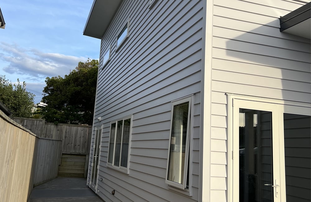 Sideview of a Wellington residential home with a new coat of off-white paint