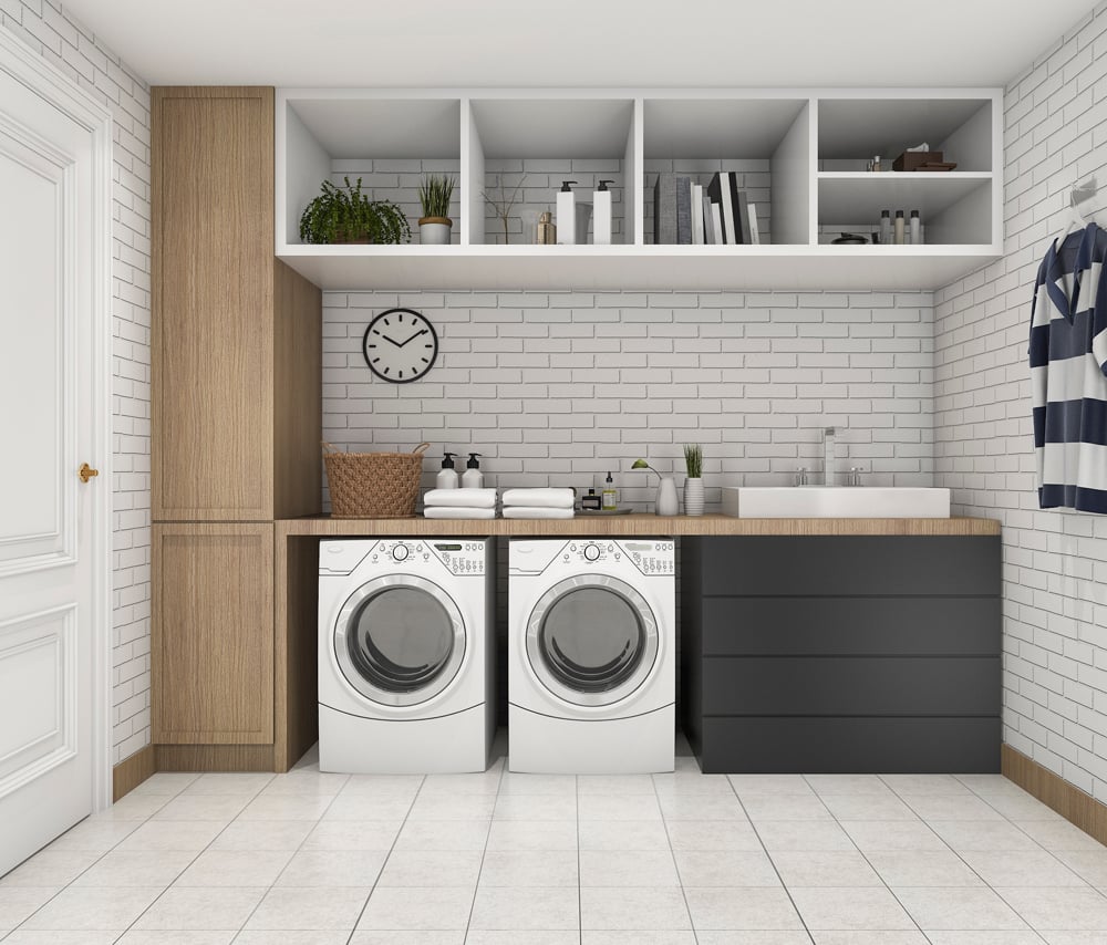 Clean and organised laundry space, perfectly fit out with a washer and dryer under a stylish wood bench