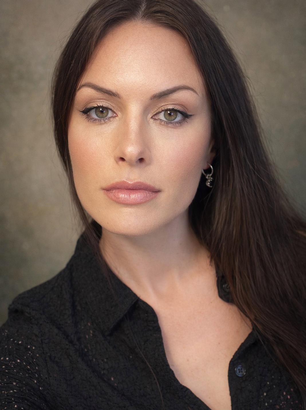 Pretty Good Facial’s founder, Megan Calkin on the Kapiti Coast beach showing off her flawless skin