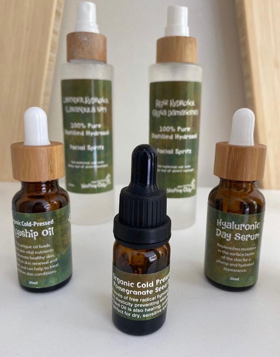 Range of New Zealand Native Oils skincare products sat on a white table shelf in one of Pretty Good Facials' spa rooms
