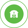 White farmhouse logo in a green circle