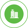 White commercial building logo in a green circle