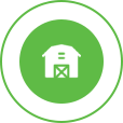 White farmhouse logo in a green circle