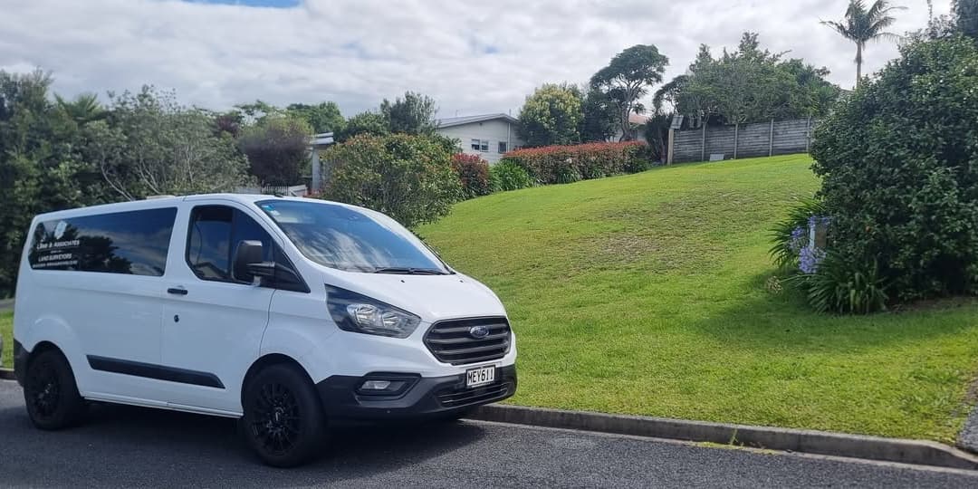 Lamb & Associates van in front of a section