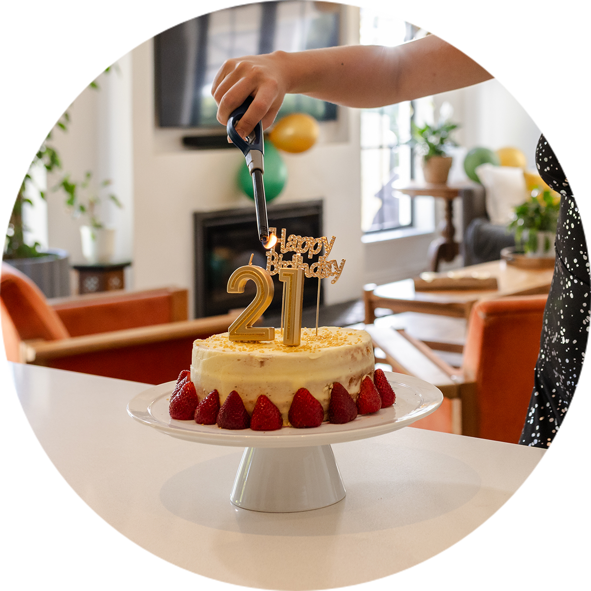 A girl's hand with a black lighter lighting the 21 candles on her birthday cake | Hire Items at Levin Party Hire