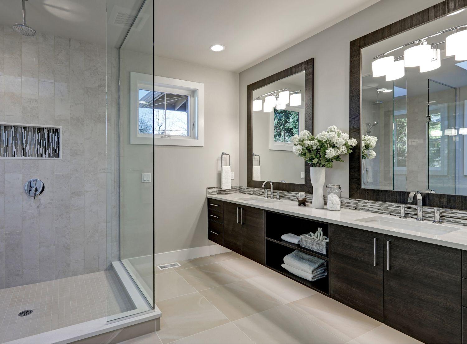 Fancy his and hers bathroom with two massive mirrors and a large open shower