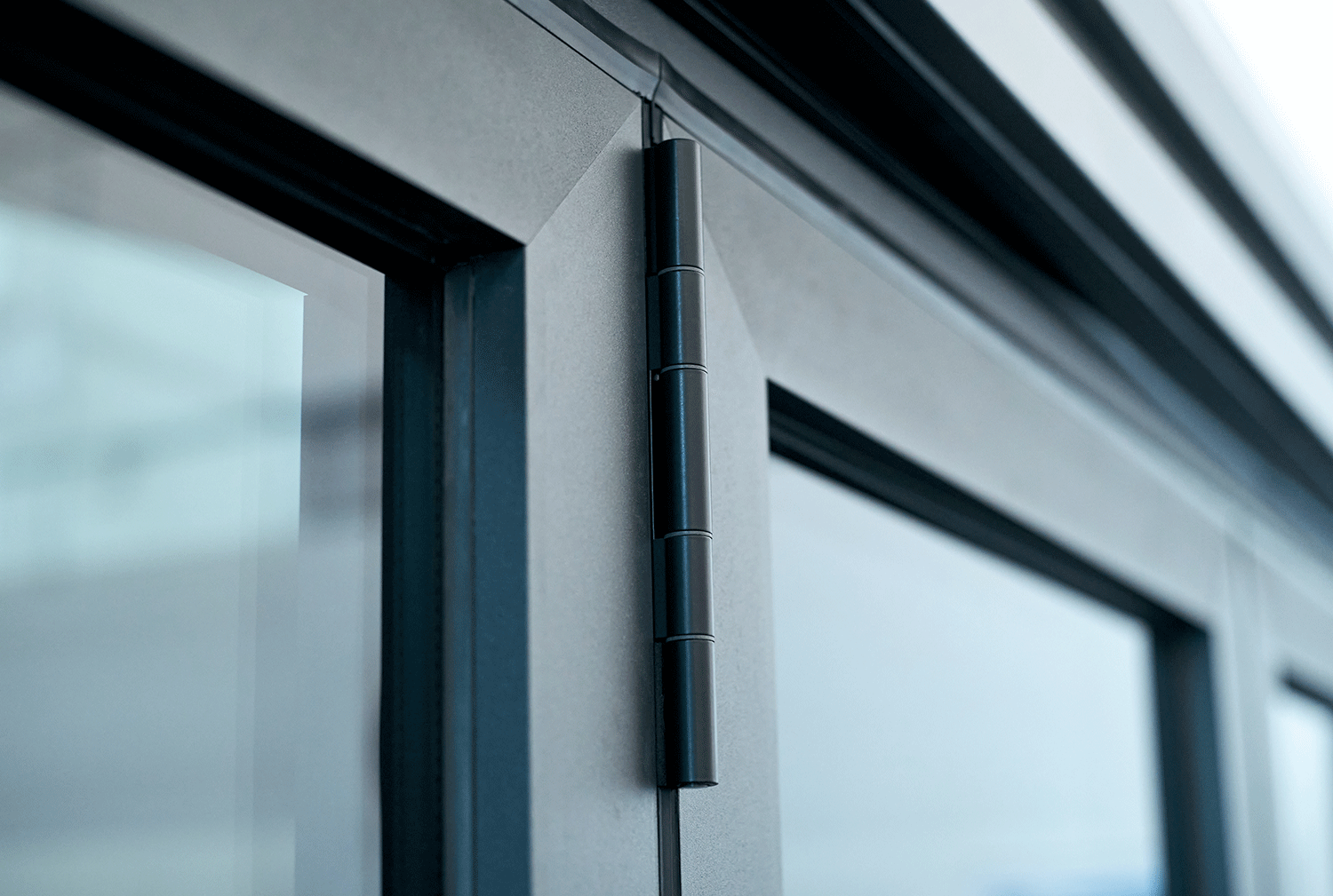 Close up of a dark grey aluminium door frame - links to aluminium colours page