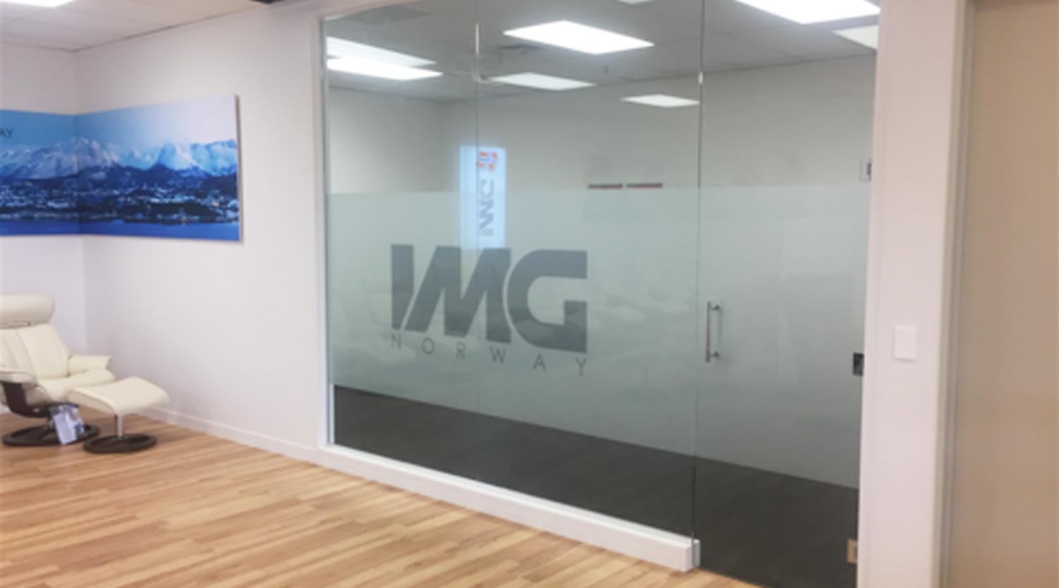 Glass wall with Frosted logo on it inside an office building - links to the Interior and Exterior Glass Page 