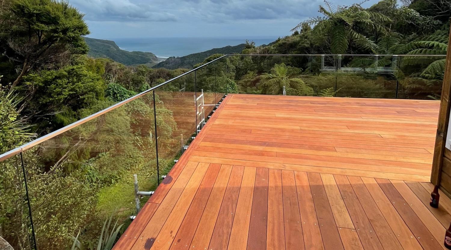 Glass balustrade with a top frame surrounding the edges of a second story balcony deck - Links to Glass Balustrades page