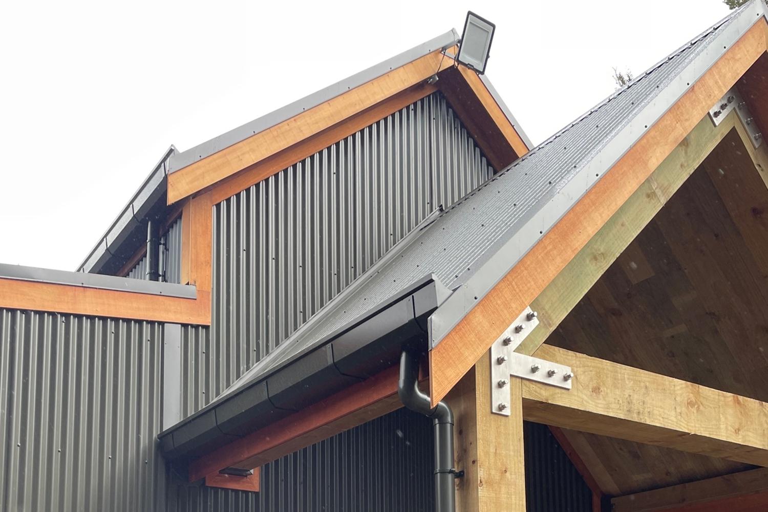 Bevelled box guttering and round downpipes