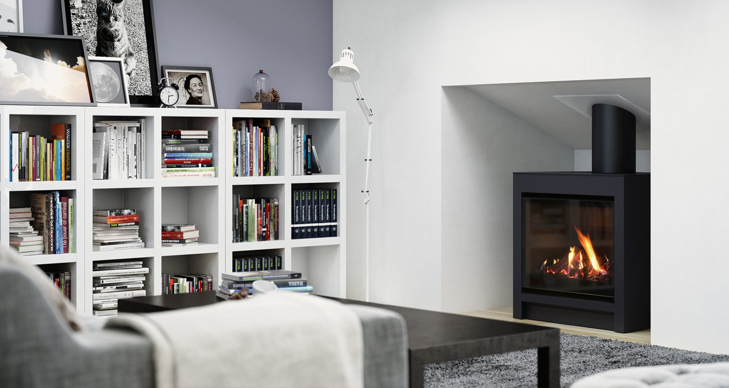 Cozy white room with a grey couch, filled white bookshelf, and a built in cubby that holds a large freestanding black gas fire