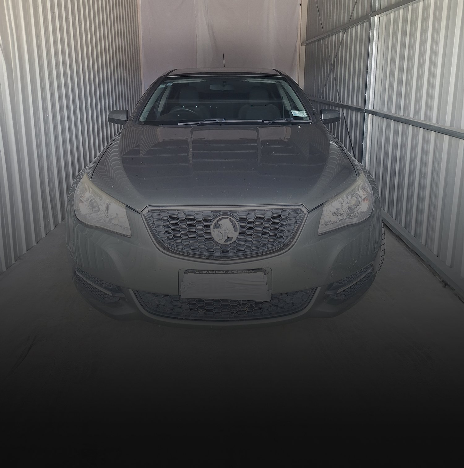 The front of a Silver Medium sized car parked inside one of the Storage Units | Links to the 'What We Do' page