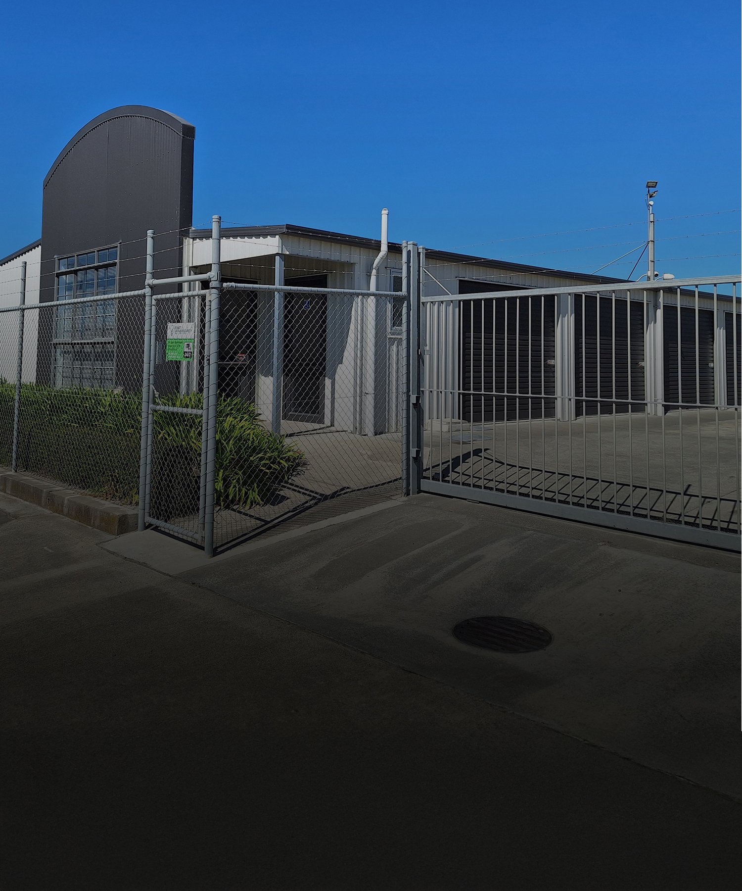 Image outside the front gate of the Five Star Self Storage Facility with secure fencing and barbed wire on top | Links to the 'Our Facility' page Gallery
