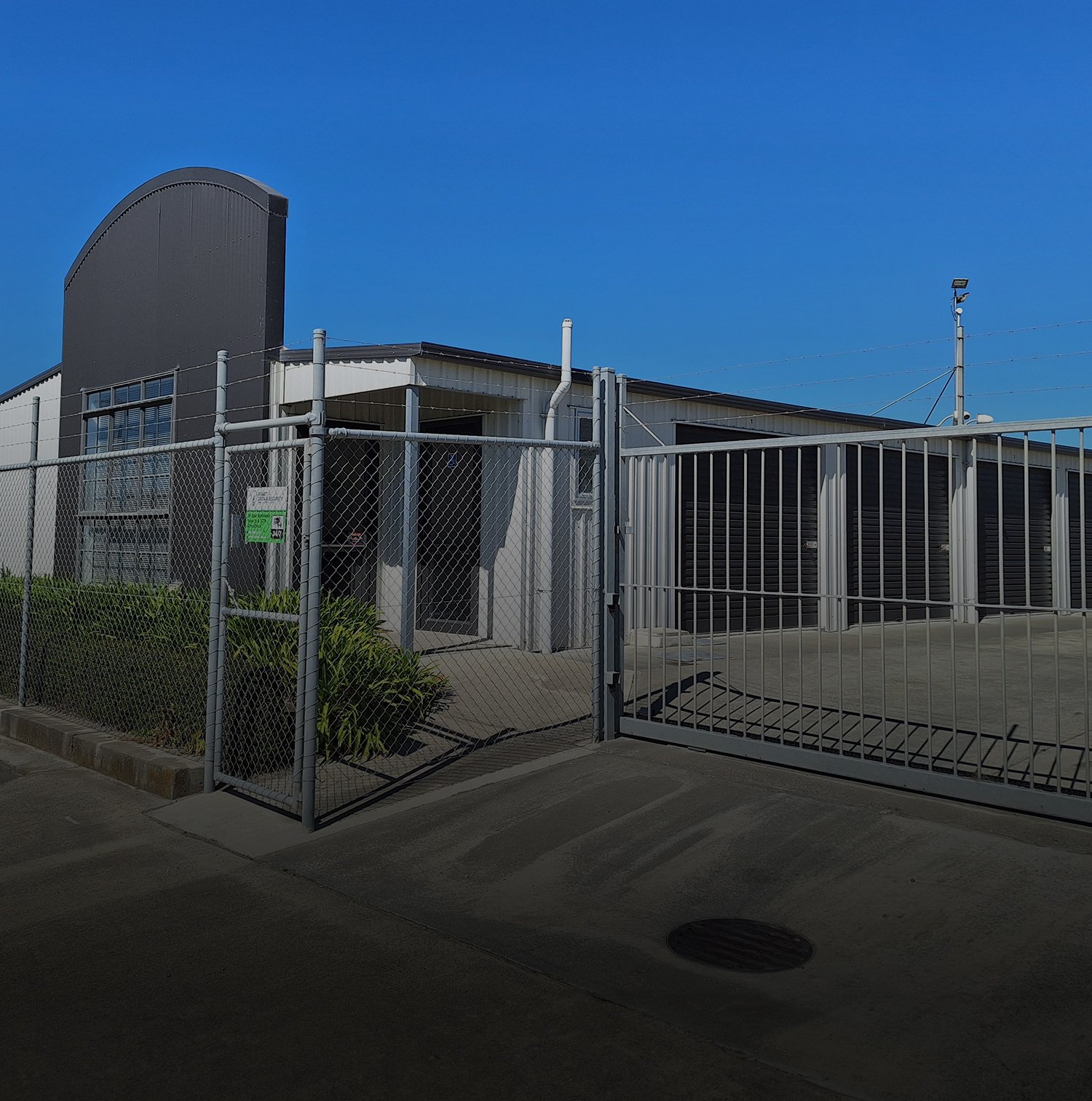 Image outside the front gate of the Five Star Self Storage Facility with secure fencing and barbed wire on top | Links to the 'Our Facility' page Gallery
