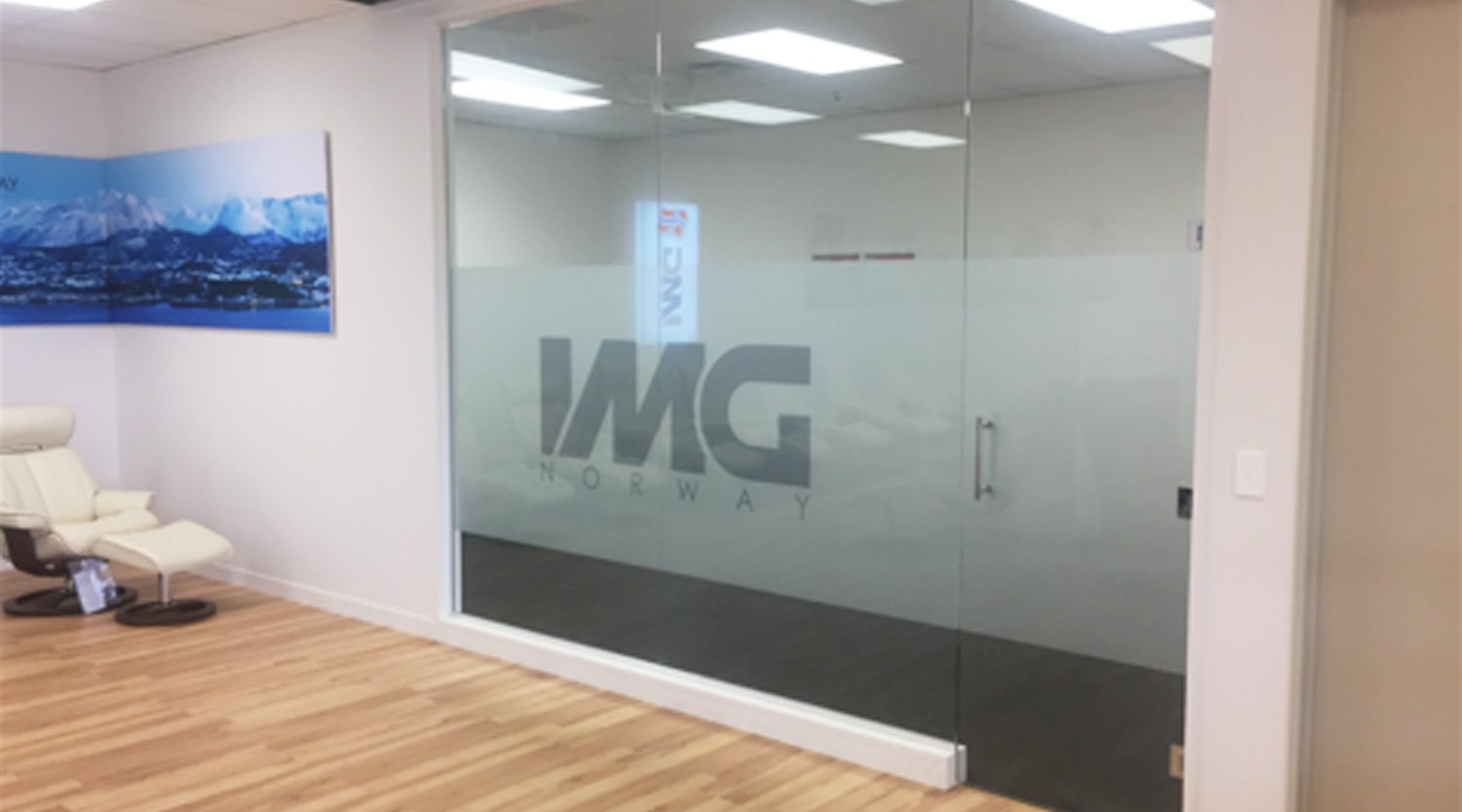 Glass wall with Frosted logo on it inside an office building - links to the Interior and Exterior Glass Page 