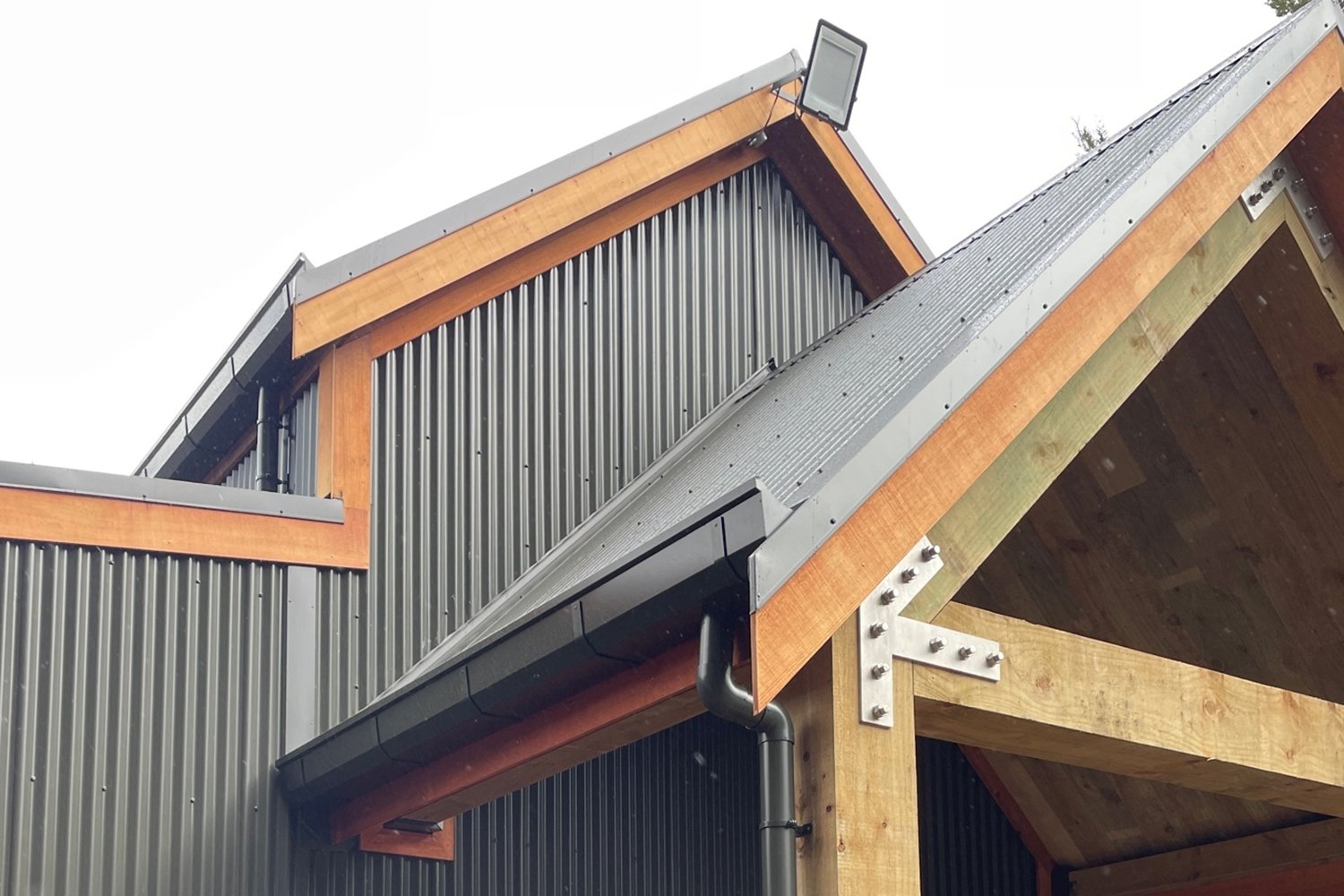 Bevelled box guttering and round downpipes