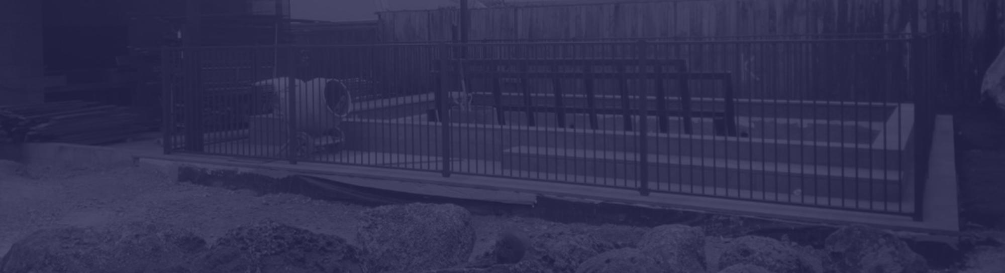 Unfinished backyard with a newly poured concrete pool and an excavated yard ready for new soil and grass