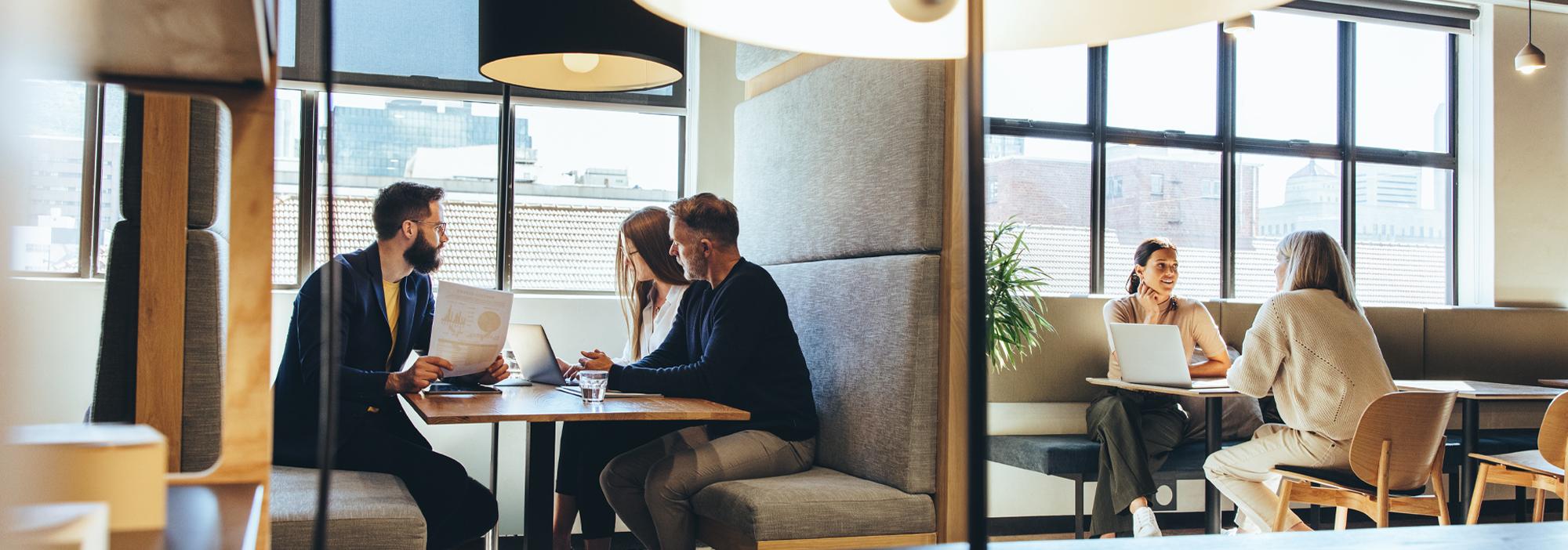 XO Recruitment specialists interviewing potential candidates in fancy office booths
