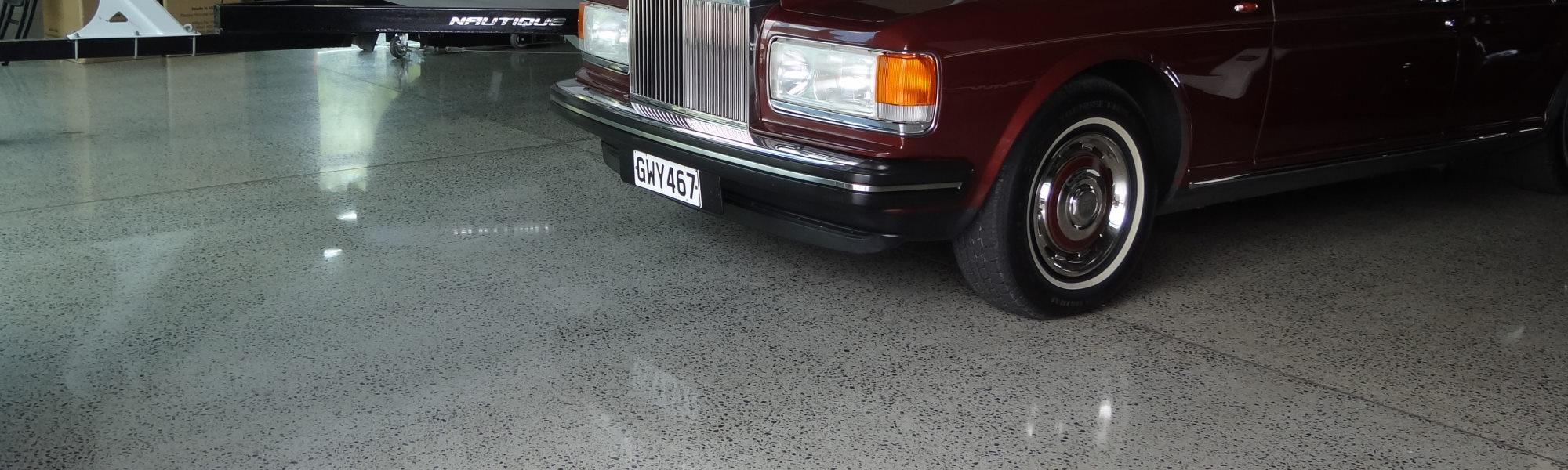 Classic car parked on a newly polished concrete garage floor in a residential home