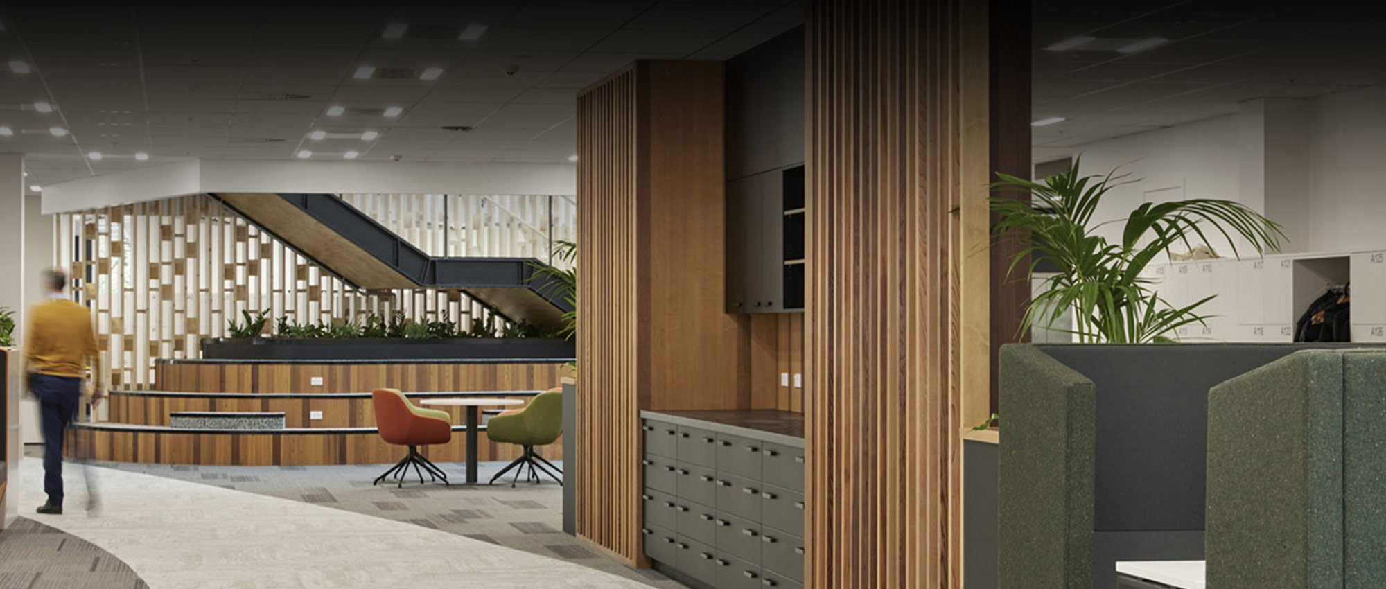 Commercial business lobby with elegant wood accents and designs implemented by Colourform Joinery
