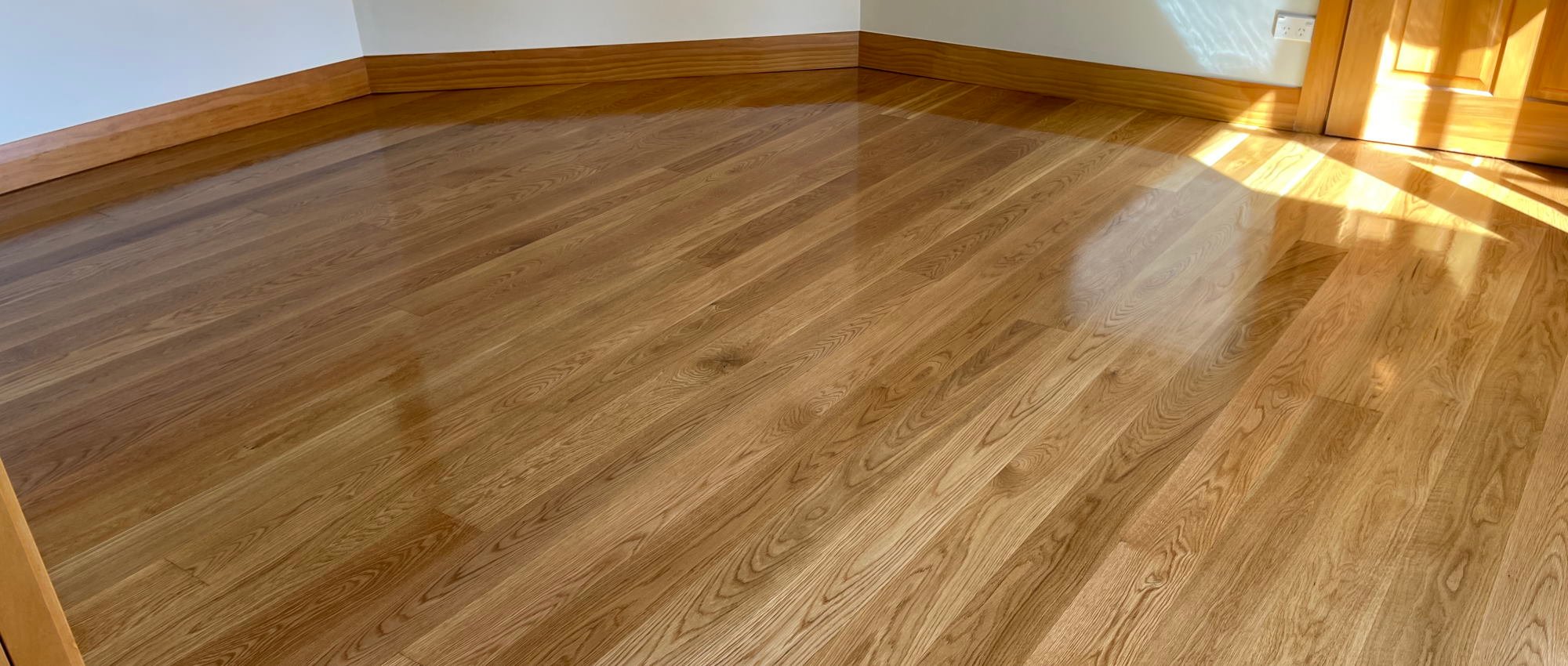 Beautiful refinished timber floor, skirtings and door in a residential room