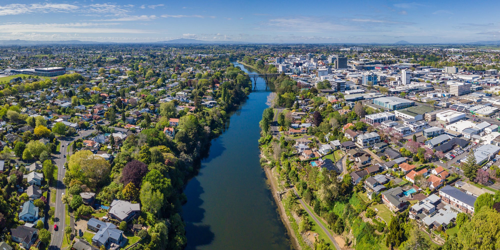 Entire town view from the sky that shows the Waikato river and all the surrounding properties