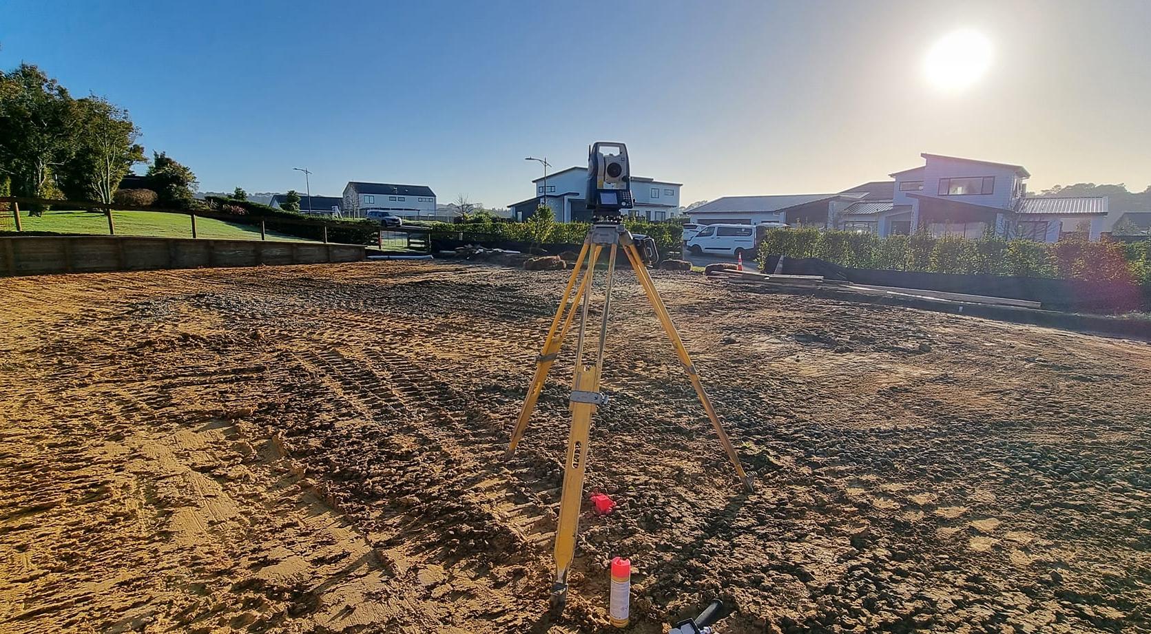 surveying equipment on a bare subdivision