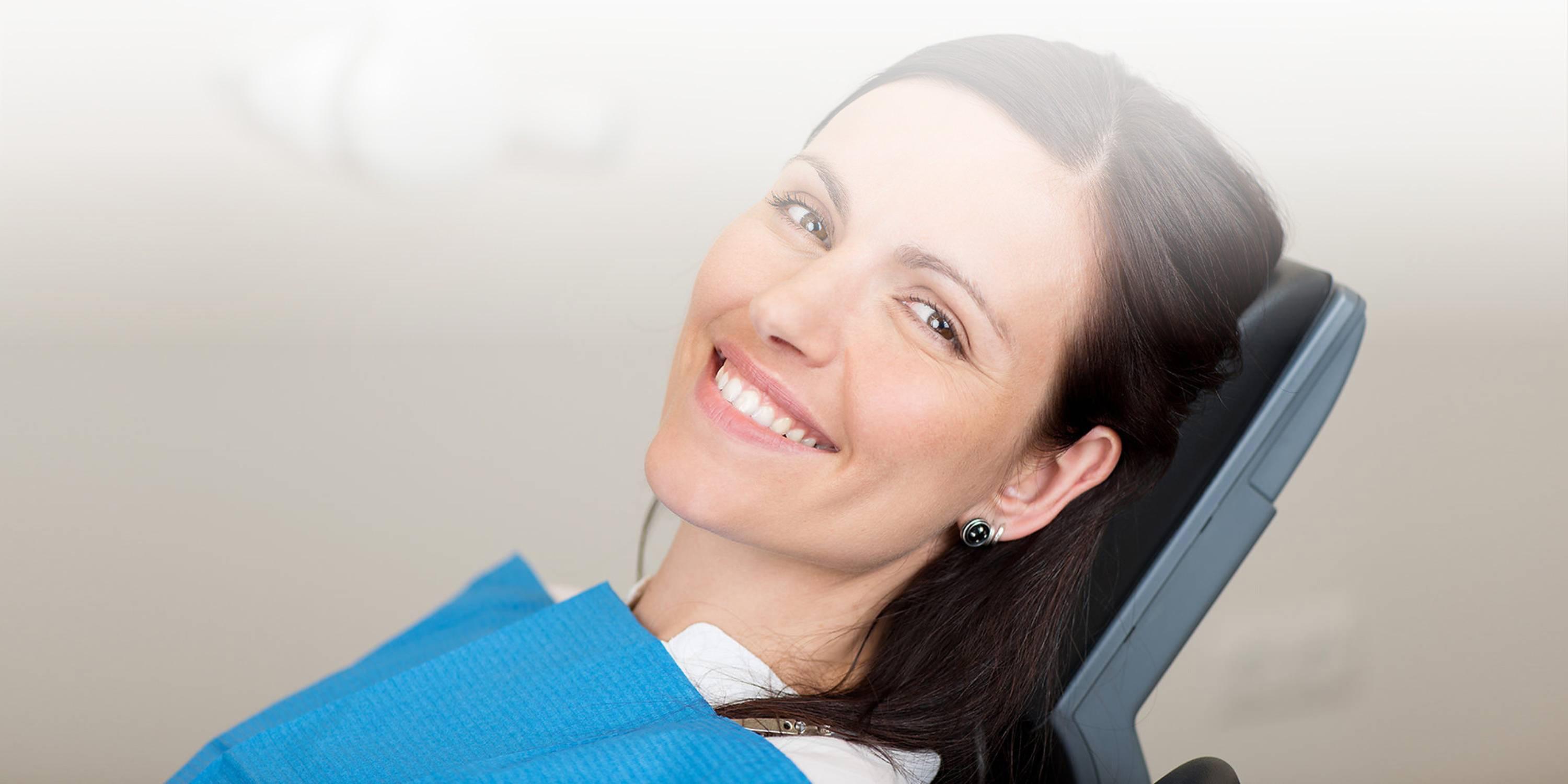 Woman with relaxed smile having dental treatment in Queenstown
