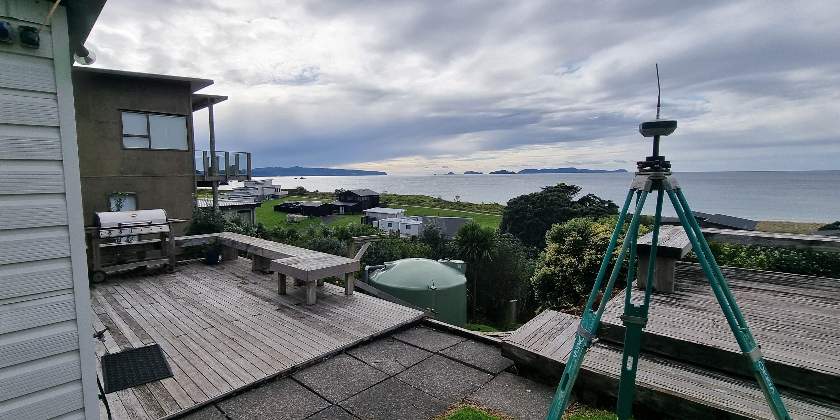 surveying equipment with a sea view in the background