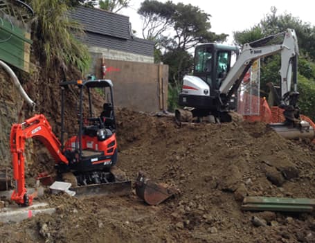 NZ Tiny Home Movers preparing a site by leveling the ground with heavy machinery 
