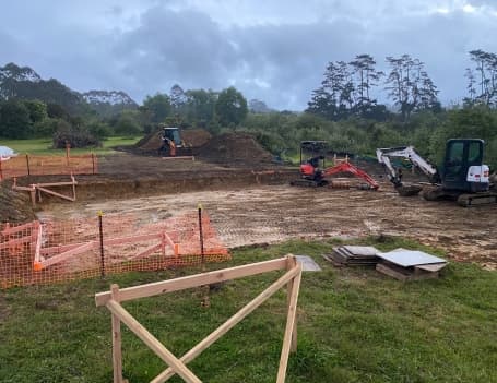 NZ Tiny Home Movers preparing a site by leveling the ground with heavy machinery 