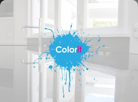 Modern black and white kitchen with a custom made black splashback cut to fit under a window above the sink