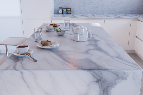 Beautiful white quartz kitchen waterfall island with a meal and tea set for two, in a kitchen with white minimalist cabinets