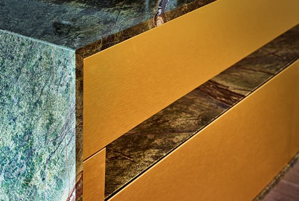 Green and blue nature-like benchtop with orange wood cabinets