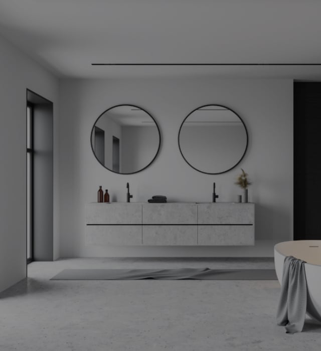 Floating porcelain his and hers sink in a classy bathroom with two round black-framed mirrors and a large white tub