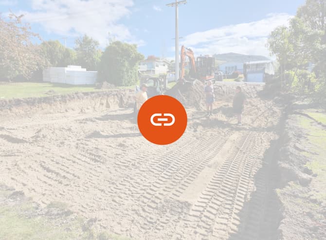 Three members of the A1 Bobcats & Concrete team standing with their heavy machinery on a recently laid sand pad