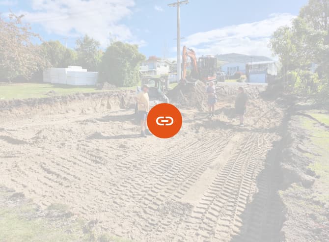 Three members of the A1 Bobcats & Concrete team standing with their heavy machinery on a recently laid sand pad