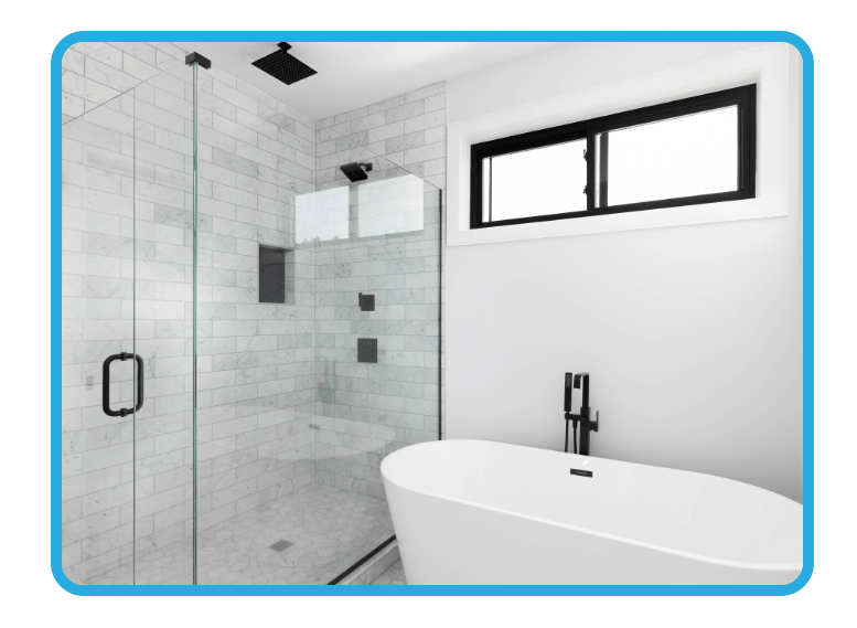 Modern bathroom with freshly painted white walls, a big white tub, and a large shower with a ceiling-high white tile splashback