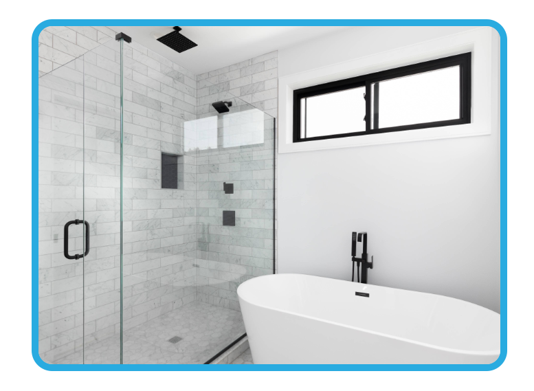 Modern bathroom with freshly painted white walls, a big white tub, and a large shower with a ceiling-high white tile splashback
