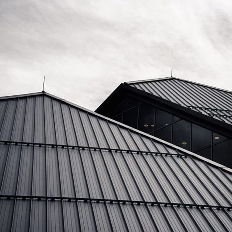 Sleek black roof of a Wellington business recently given a new coat of paint to protect it against the elements
