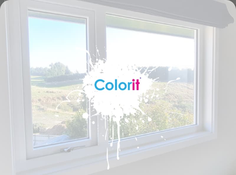 White uPVC window frame from the inside of a rural house that shows the outside view with lines of trees and large fields