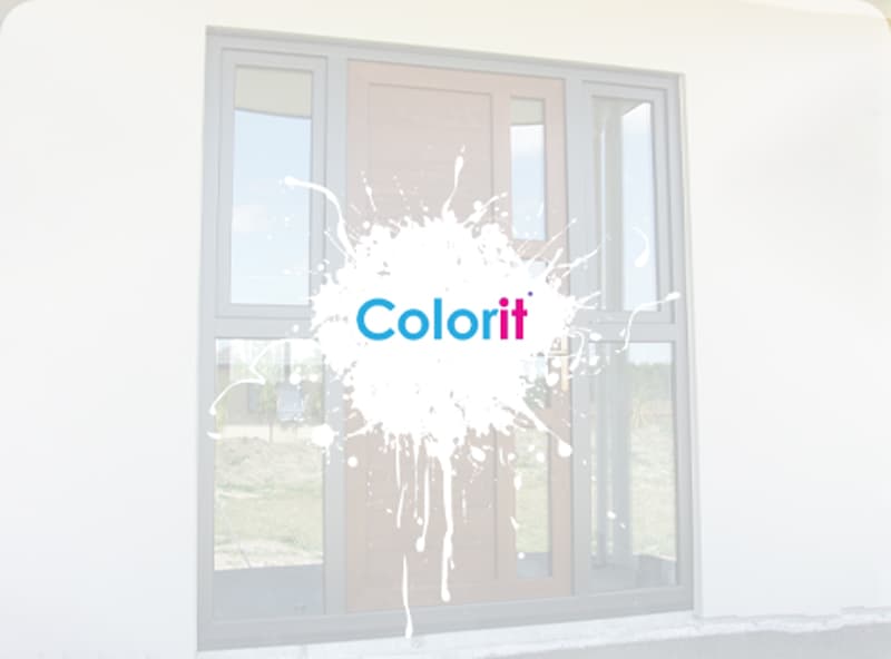 Brown front door with little vertical windows on either side, all with black uPVC framing