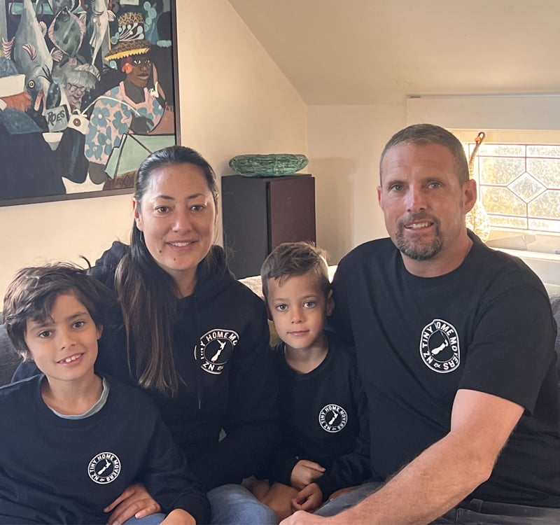 NZ Tiny Home Movers' owner and qualified builder Ezra Clark with his wife and two sons all wearing the company shirt