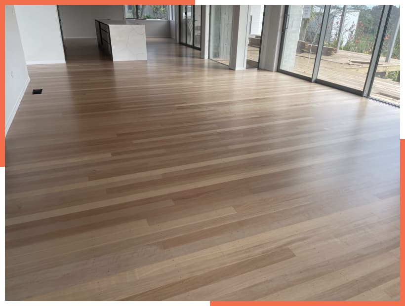 Residential home with a beautiful minimalistic kitchen with a marble island and newly finished timber floor