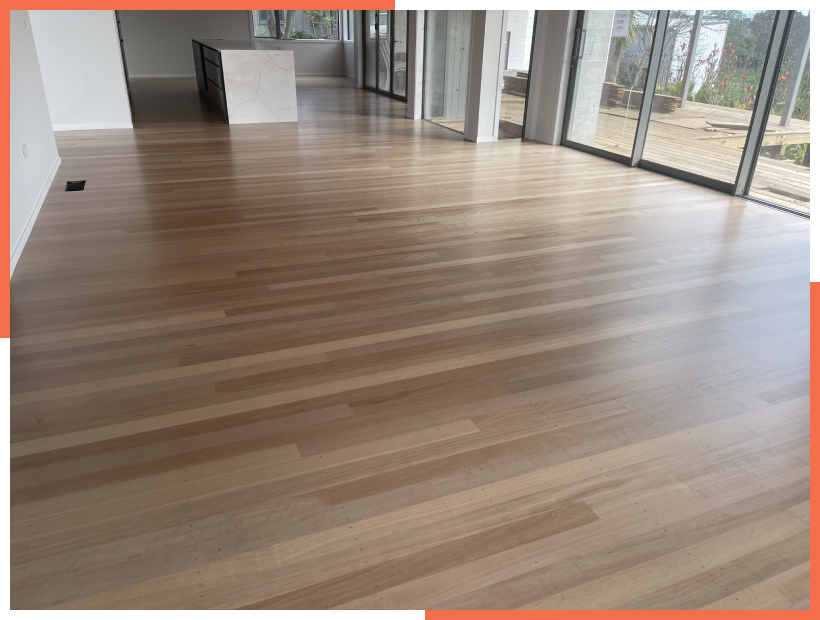 Residential home with a beautiful minimalistic kitchen with a marble island and newly finished timber floor